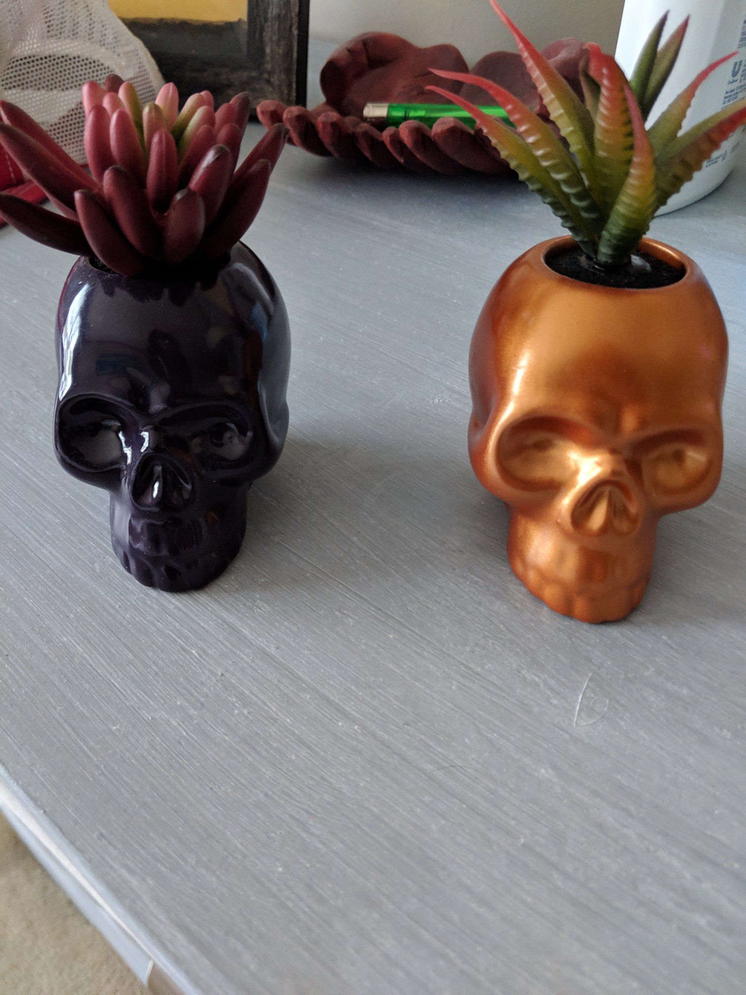 Two mini skull planters