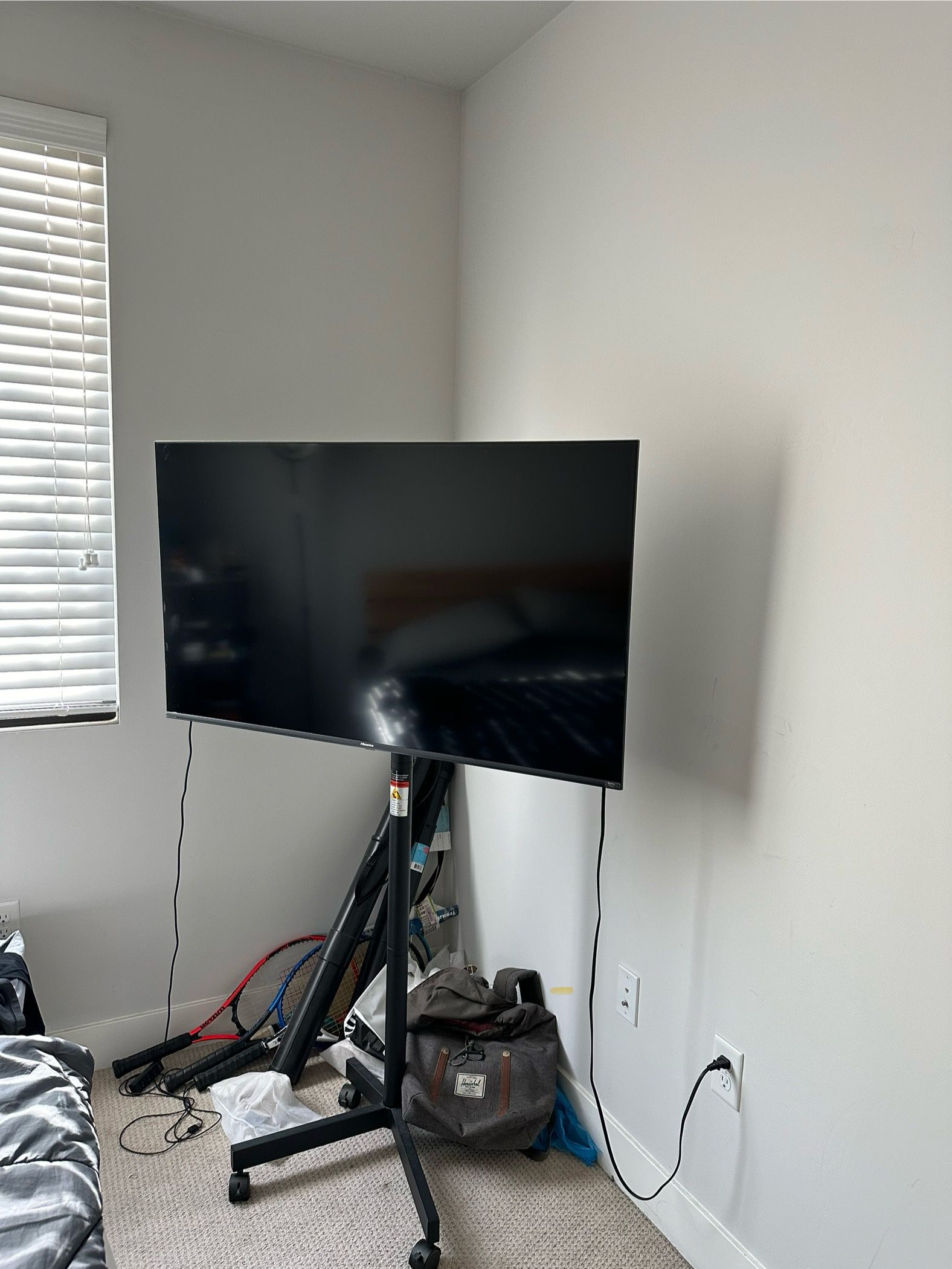 Hisense 50 inch TV with a mobile stand