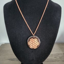 Shungite & Quartz Orgonite Necklace – Copper Flower of Life Pendant, 20″ Chain


Description:

This necklace features a round orgonite pendant crafted