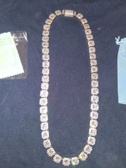 New tennis chain. Used only few times i paid $300  I'm asking $100  its 24" or 26"