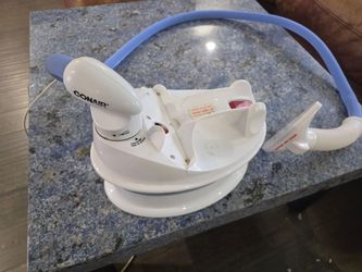 Conair GS4 Compact Fabric Steamer with an attached steam hose and nozzle.