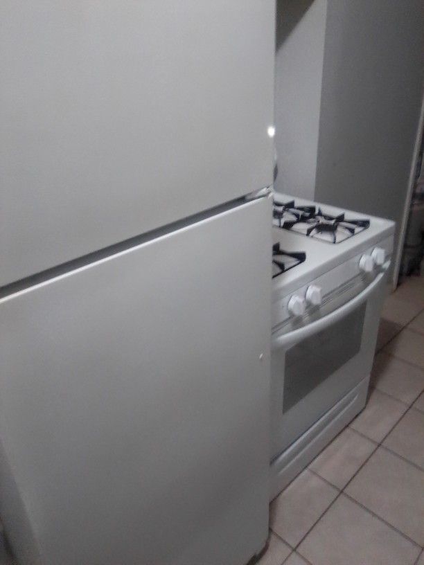 GE, Refrigerator & A Frigidaire Stove 