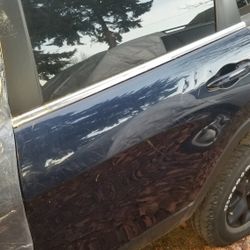 Jeep Cherokee Rear Left Door And A Rim