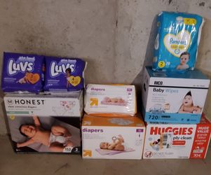 4 Packs Of Diapers, 2 Boxes Of Diapers,& 2 Boxes Of Baby Wipes