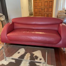 Red leather sofa and chair wth ottoman