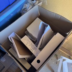 Box Full Of Paper Holders And Notebooks And Highlighters