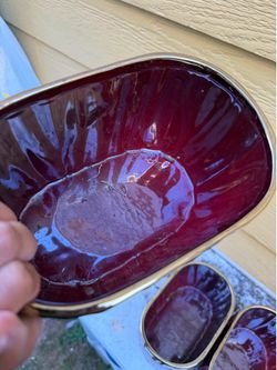 Red flower pot with gold painted rim