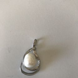 Silver and pearl charm