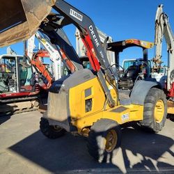 John Deere 210L Skip loader