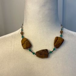 Stone and Bead Necklace  Unique necklace with large stone pieces and turquoise beads.