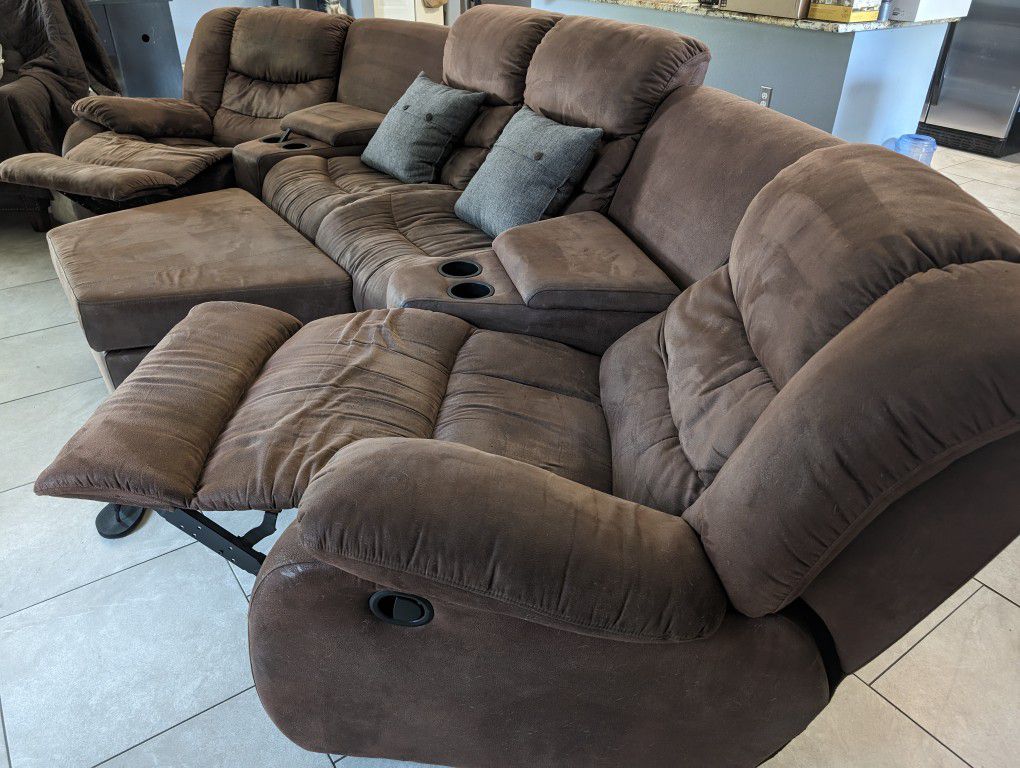Brown Microfiber Couch, Three Panels, With Two Reclining Ends, Also Comes With An Ottoman For Storage.