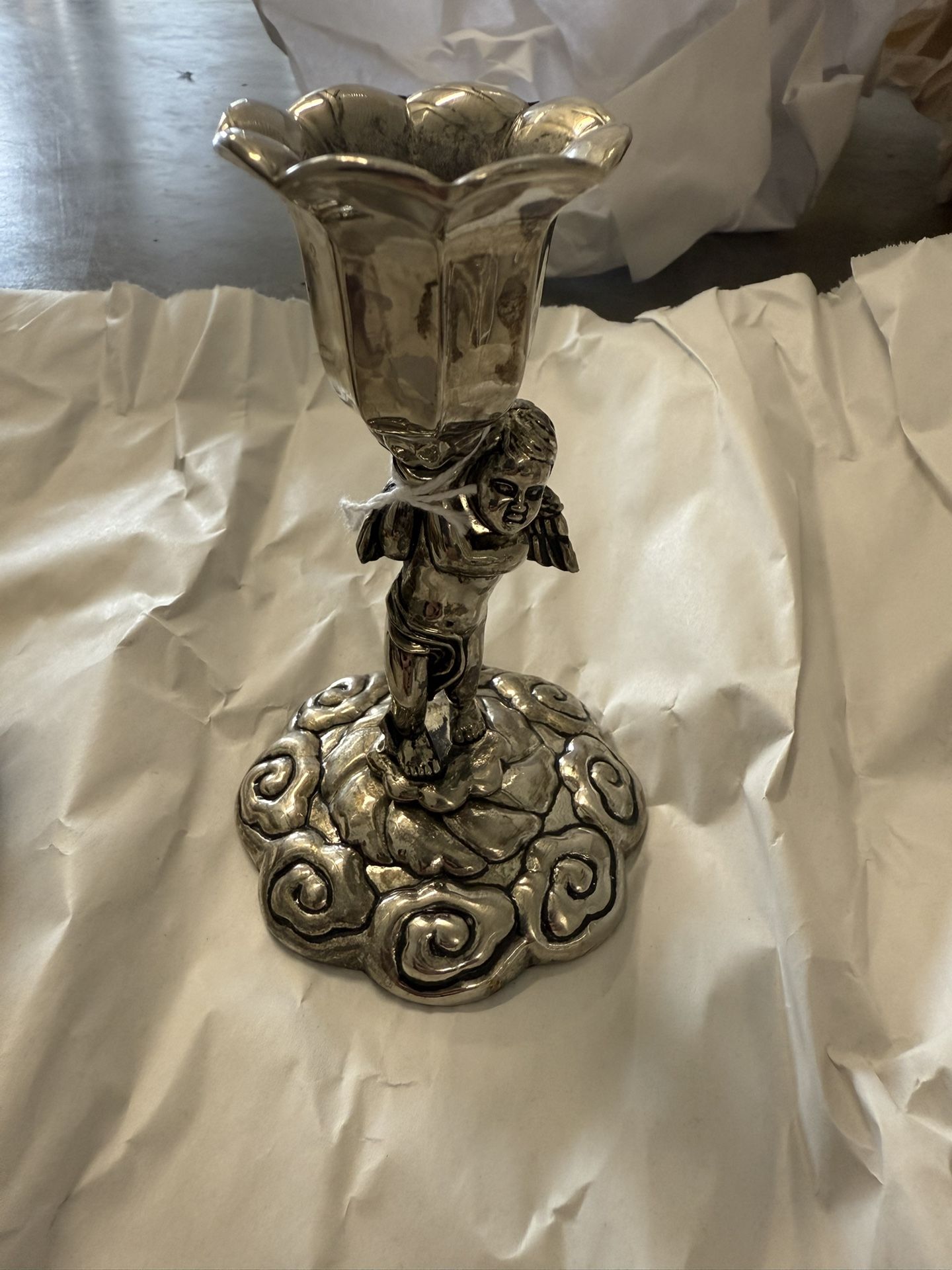 vintage silver-plated candlestick holder featuring a romantic angel motif