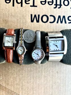 Lot of 4 women’s watches is in good condition.