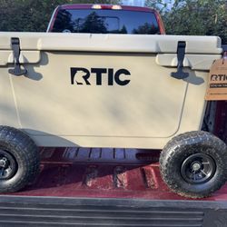 RTIC 65 Tan Cooler With 4 Wheels Added On.