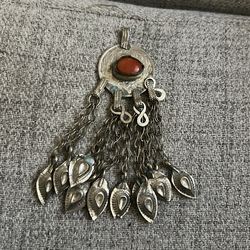 This is an Antique Iranian pendant .
