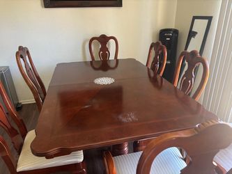 Wooden dining table set with six chairs