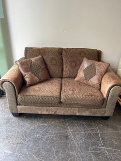 Brown and Rust Pattern Loveseat with Leather Accent