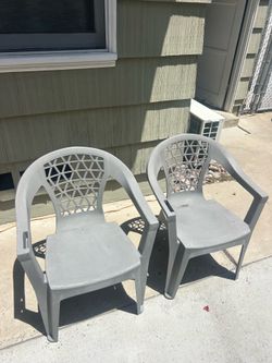 Two grey outdoor chairs
