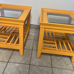 two matching mango colored end tables 