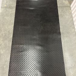 Four Black Rubber Floor Mats