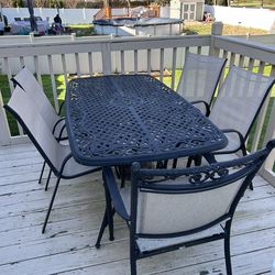 Outdoor tables chairs and umbrella