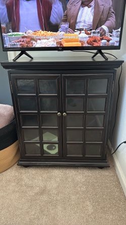 Glass door television cabinet.