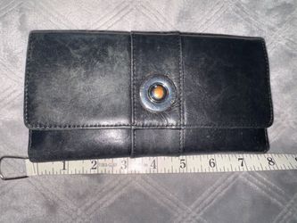 In excellent condition, the hardware circle is little faded,otherwise  perfect wallet