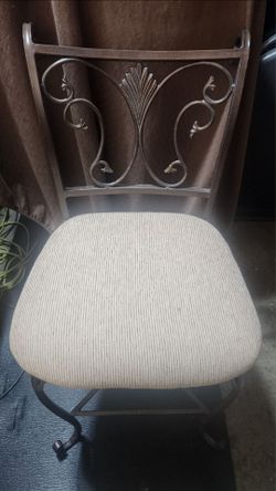 1 wrought iron bar stool with cushioned seat