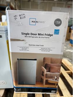 Mainstays 4.4 Cubic Feet Single Door Mini Fridge in a stainless steel