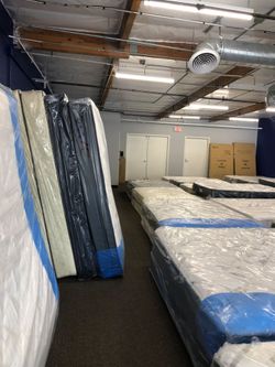 New Mattresses Still in Plastic Wrap