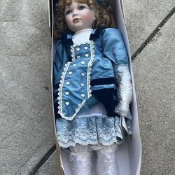 Porcelain Doll in Blue Dress