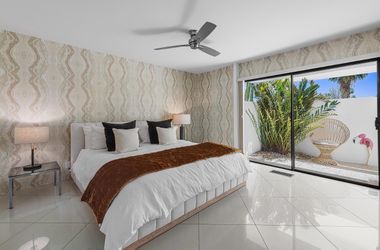 King size bed, mattress, two lamps and tables
