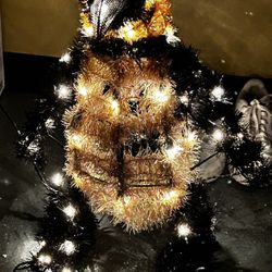 Outdoor holiday decor set up three penguins