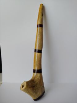 Bone pipe with wood inlay