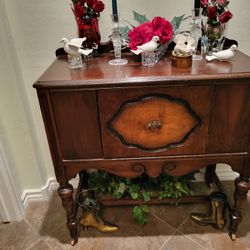 Antique Hutch Wood wheels Door opens and shuts.\nPerfect heavy