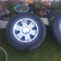 Three-quarter Ton Chevrolet Lug 18in Rims With Tires Tires Are 25% All Hold Air Ready To Bowl Down And Run For The Summer Or Until Bald