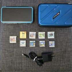 New Nintendo 2DS XL (8 games, charger, case)