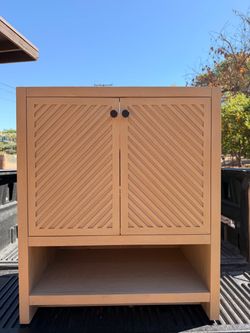 Light Wood Cabinet with Chevron Doors