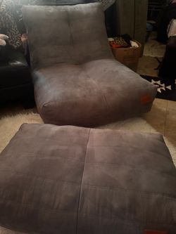 Gray Cvorth chair and footrest