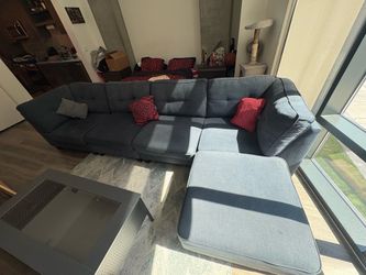 Dark blue sectional with ottoman