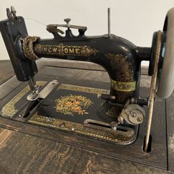 Vintage New Home Sewing Machine with wheeled cabinet 