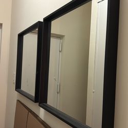 Two black square mirrors