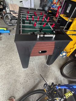 Foosball Table with Red and Black Players