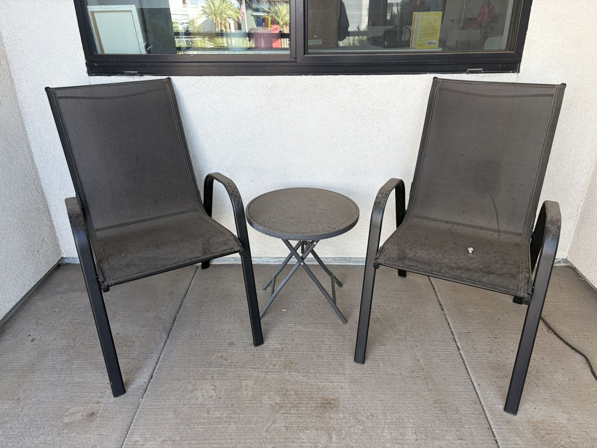 Two Black Patio Chairs And Table
