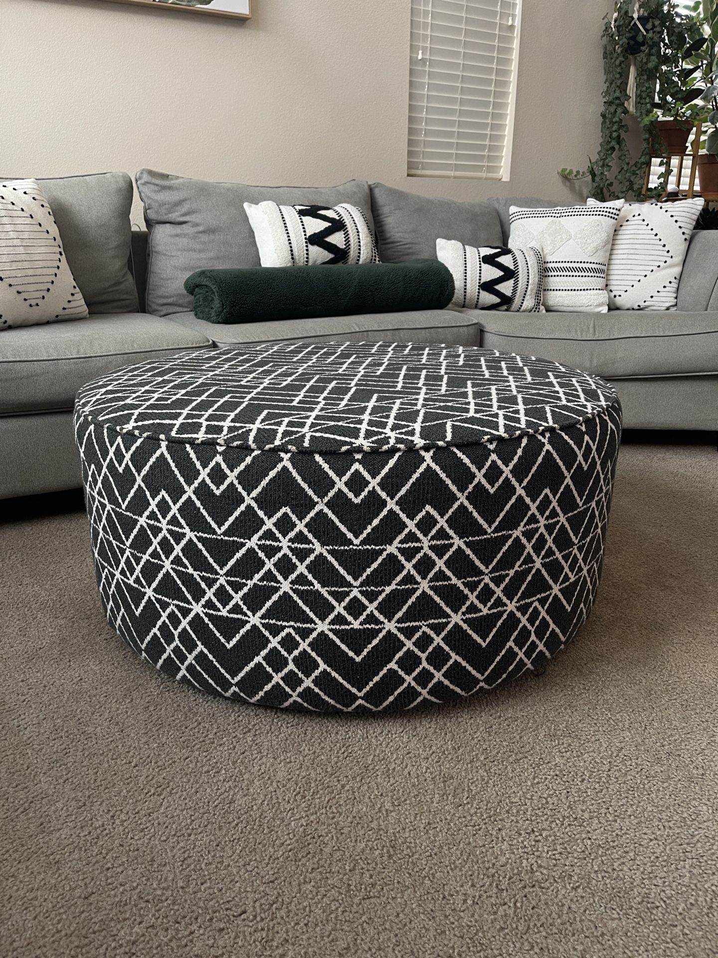 Raymour & Flanigan Daine Round Ottoman – Stylish & Functional