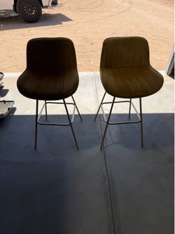 Two chairs and table “bar height”.