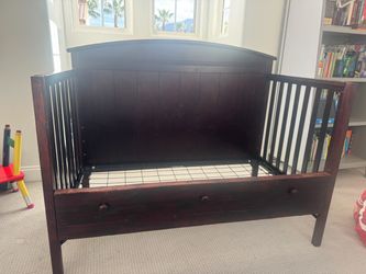 CRIB modified as a bed, includes the front side