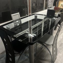 Four- Seater dining Set With A glass Table.