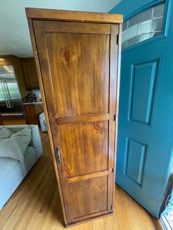 Wood cabinet with movable shelves, and pegs. (2 of 2)
