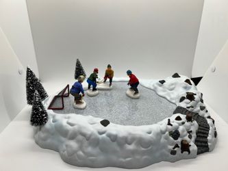 Lemax Animated Hockey Game in orig box and orig ac/dc power pack, Missing dead trees and bench. Gc.